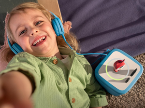 Child Listening To The Toniebox 2 And Tonie With Blue Wired Headphones For Kids
