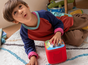 child playing with a red toniebox 2 and Tonieplay Your Playful Day with Bluey