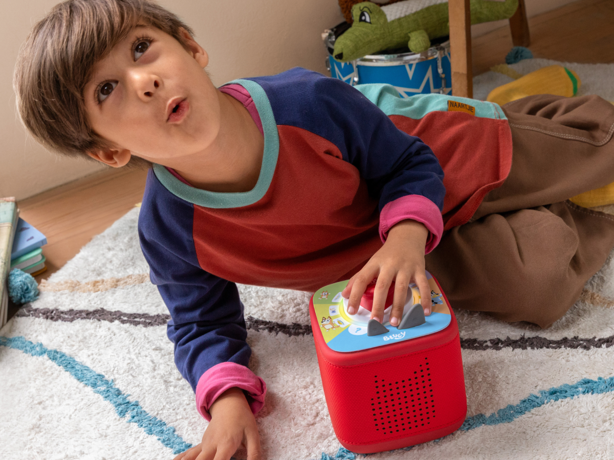 child playing with a red toniebox 2 and Tonieplay Your Playful Day with Bluey