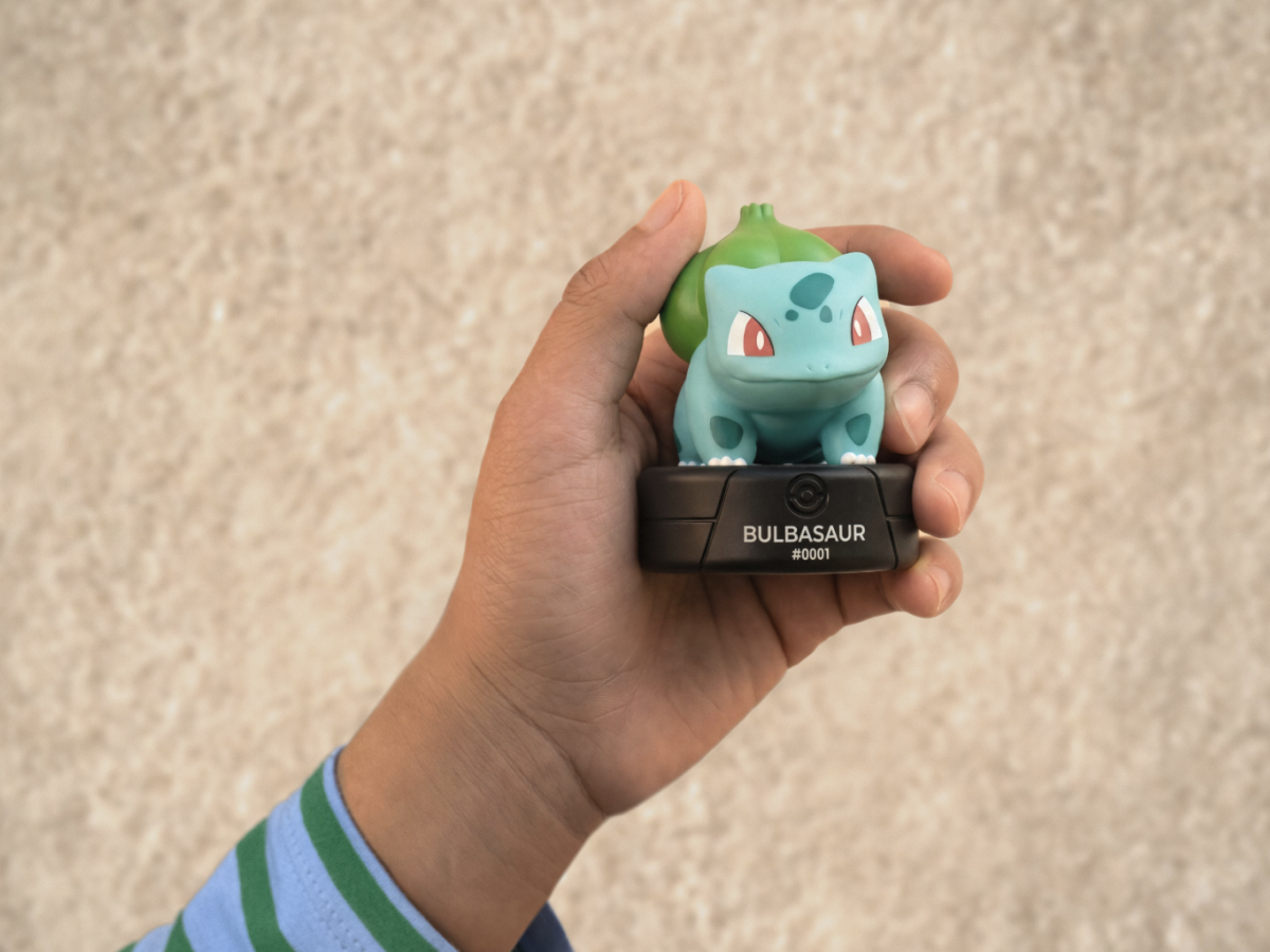child holding the Pokémon Bulbasaur Tonie