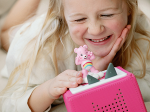 Child Playing With Care Bears: Cheer Bear Tonie