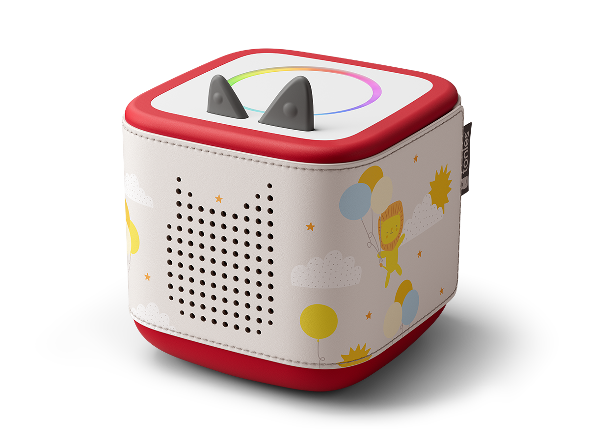 Side view of Toniebox 2 with lion, balloons, sun and clouds on it