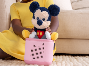 Child playing with Cuddle Tonie- Disney Mickey Mouse audio figurine and Toniebox 2