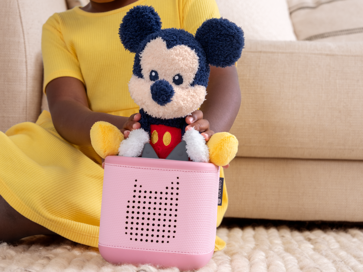 Child playing with Cuddle Tonie- Disney Mickey Mouse audio figurine and Toniebox 2