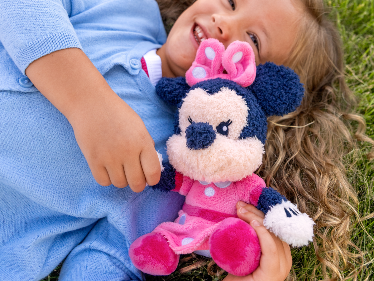 Child playing with minnie mouse cuddle Tonie audio figurine and Toniebox 2