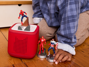 child playing with MARVEL Tonies and a Toniebox 2