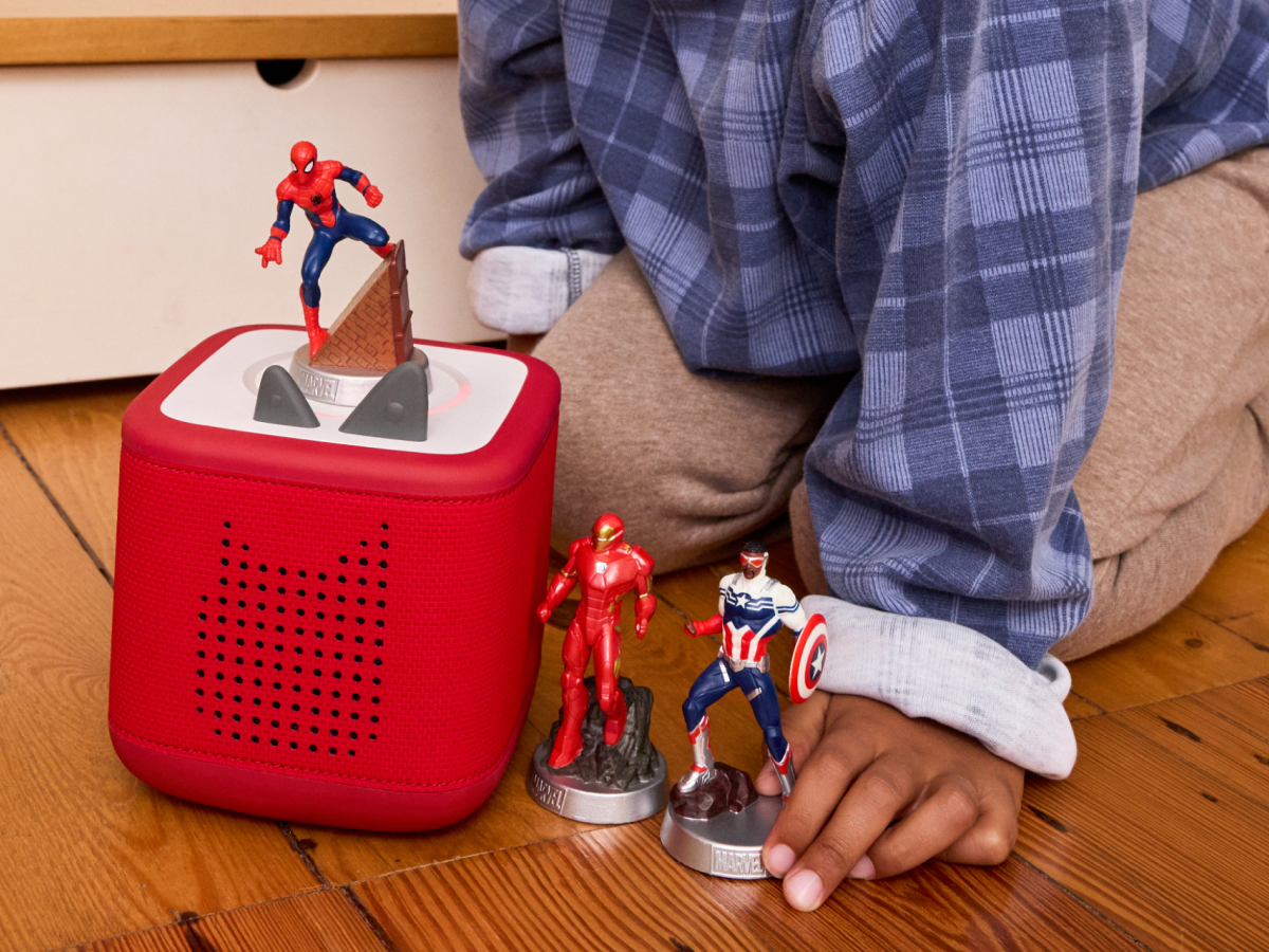child playing with MARVEL Tonies and a Toniebox 2