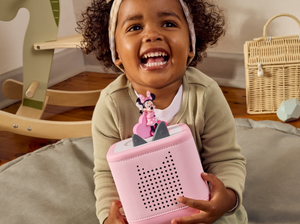 Child playing with a pink toniebox 2 and Disney Minnie Mouse Clubhouse Tonie