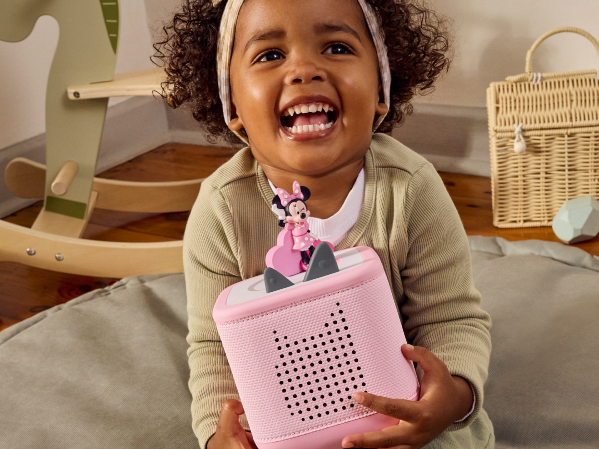 Child playing with a pink toniebox 2 and Disney Minnie Mouse Clubhouse Tonie
