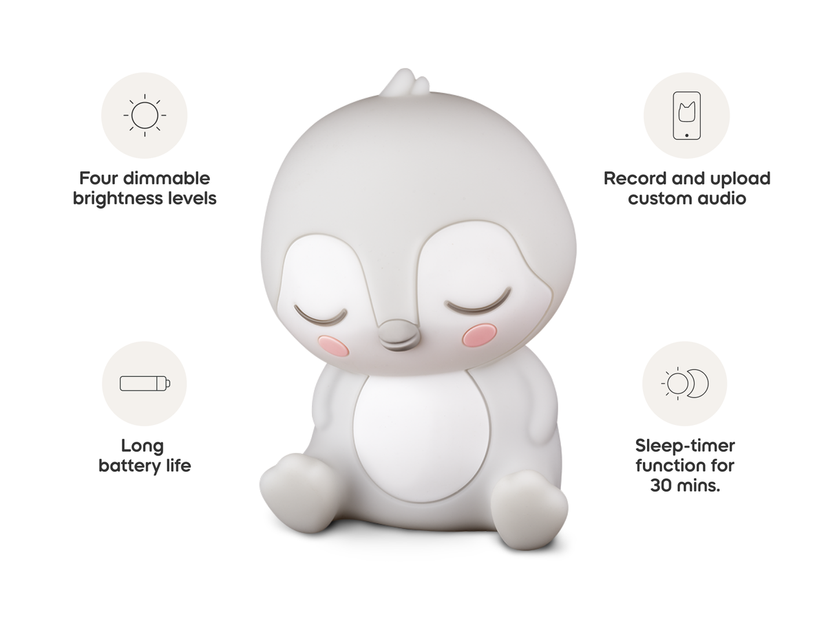 Child playing with Sleepy Friends Sleepy Penguin Night Light audio figurine and Toniebox 2