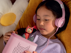 Child Listening To The Toniebox 2 And Tonie With Pinkwired Headphones For Kids