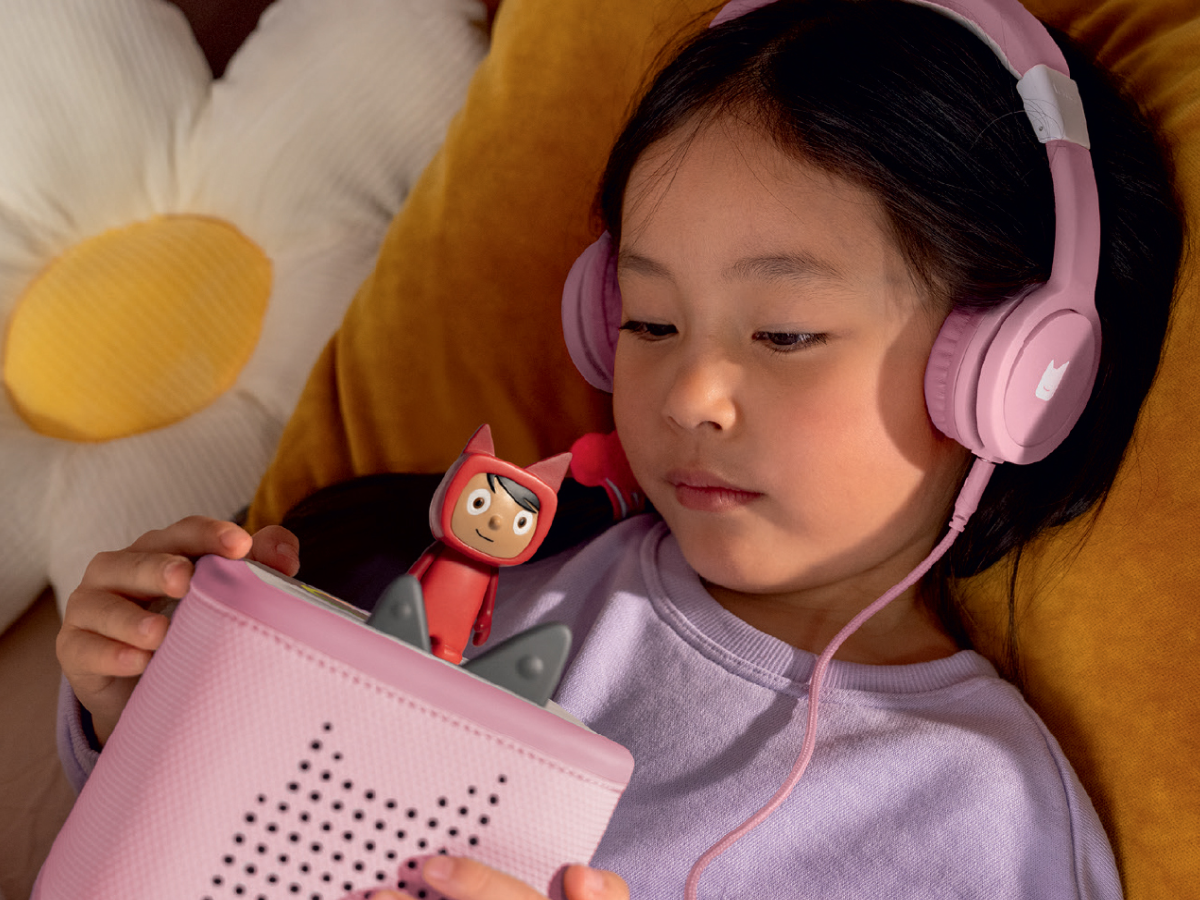 Child Listening To The Toniebox 2 And Tonie With Pinkwired Headphones For Kids