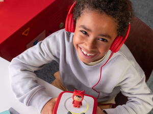 Child Listening To The Toniebox 2 And Tonie With Red Wired Headphones For Kids