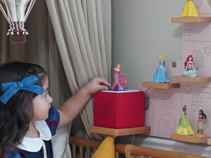 Child Playing With Disney Sleeping Beauty Tonie