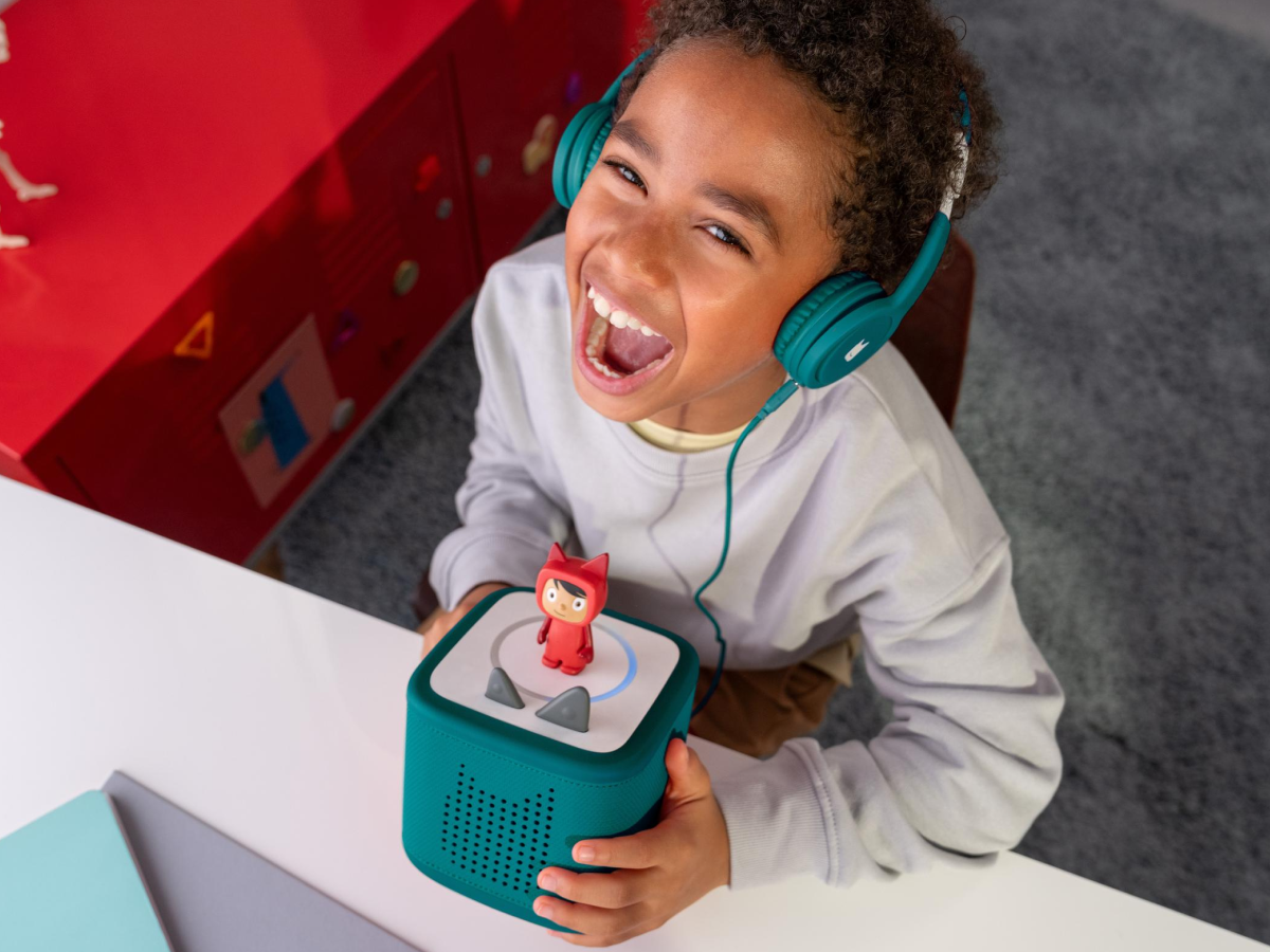 Child Listening To The Toniebox 2 And Tonie With Teal Wired Headphones For Kids