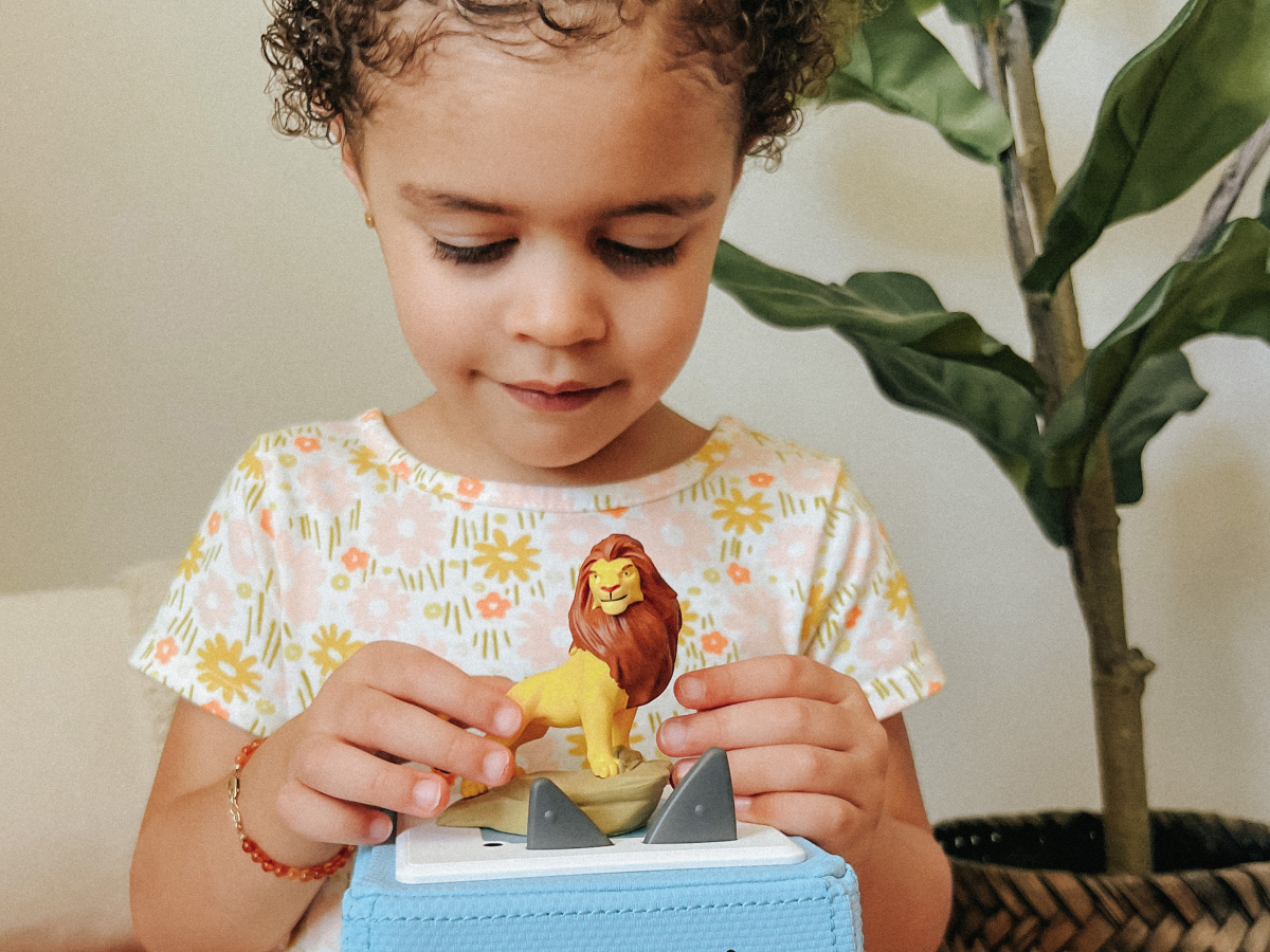 Child Playing With Disney The Lion King Tonie