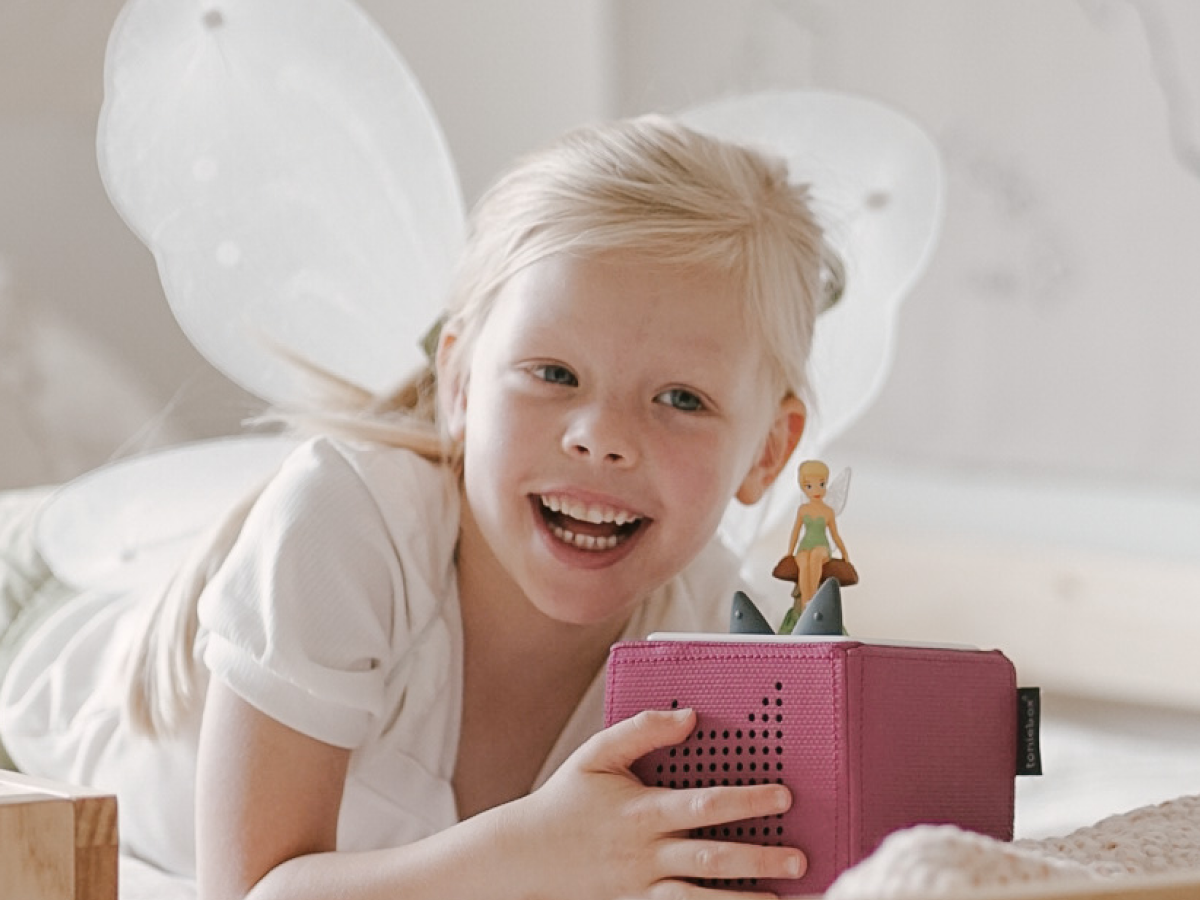 Child Playing With Disney Tinker Bell Tonie